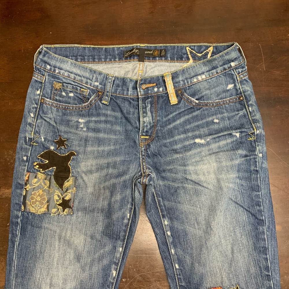 Lucky Brand jeans with bird and star patches